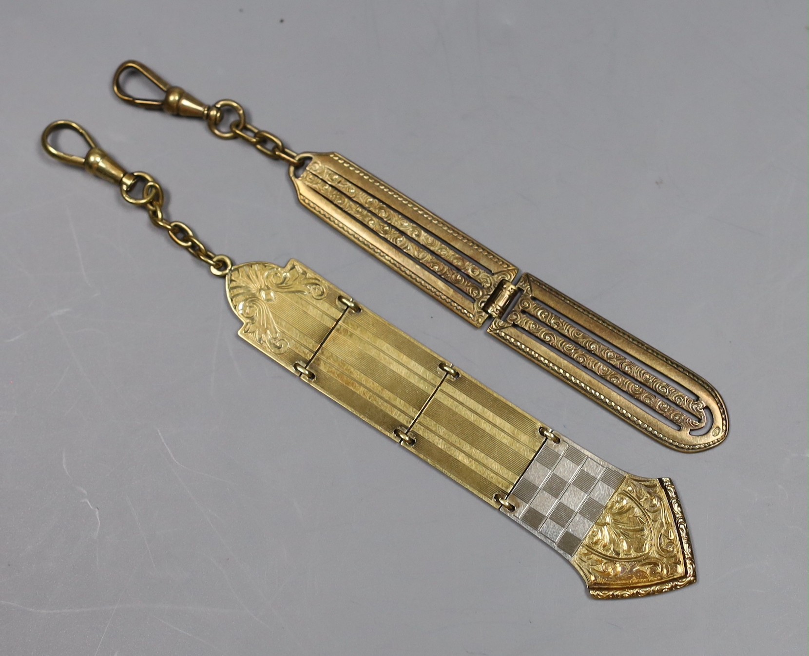 Two early 20th century Austro-Hungarian yellow metal chatelaine attachments?, approx. 85mm, one with Austro Hungarian 580 standard marks, the other stamped 14ct